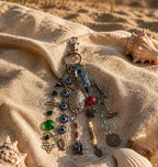 Ariel La Boutique bohemian multi-strand beaded bag charm with evil eye motifs, silver charms, and a lobster clasp.
