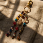 Ariel La Boutique bohemian beaded keychain with multi-colored crystals, polished stones, and a gold-tone lobster clasp.