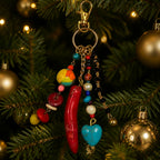 Ariel La Boutique bohemian beaded keychain with red horn, turquoise heart, and colorful pearls on a Christmas tree.