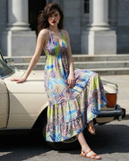 Ariel La Boutique bohemian halter neck maxi dress with a multi-colored paisley print in lime green and blue.