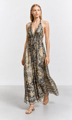 Ariel La Boutique bohemian maxi dress with halter neck, plunging bodice, and earthy-toned print on a model.