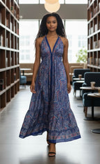 Ariel La Boutique bohemian paisley print halter maxi dress with a deep V-neck and tiered skirt worn by a model.