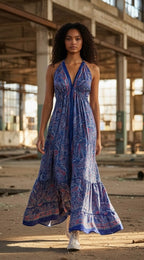 Ariel La Boutique bohemian paisley print halter maxi dress with a deep V-neck and tiered skirt worn by a model.
