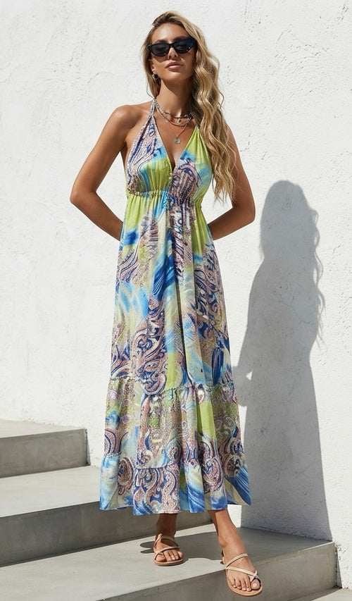 Ariel La Boutique bohemian halter neck maxi dress in lime green and blue paisley print with a tiered flowy skirt.