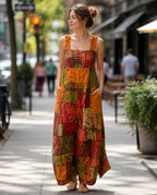 Ariel La Boutique bohemian patchwork wide-leg jumpsuit in earthy tones with ruffled straps and pockets on a city street