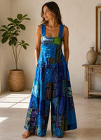 Ariel La Boutique patchwork wide-leg sleeveless jumpsuit in blue and green tones with a square neckline and pockets.